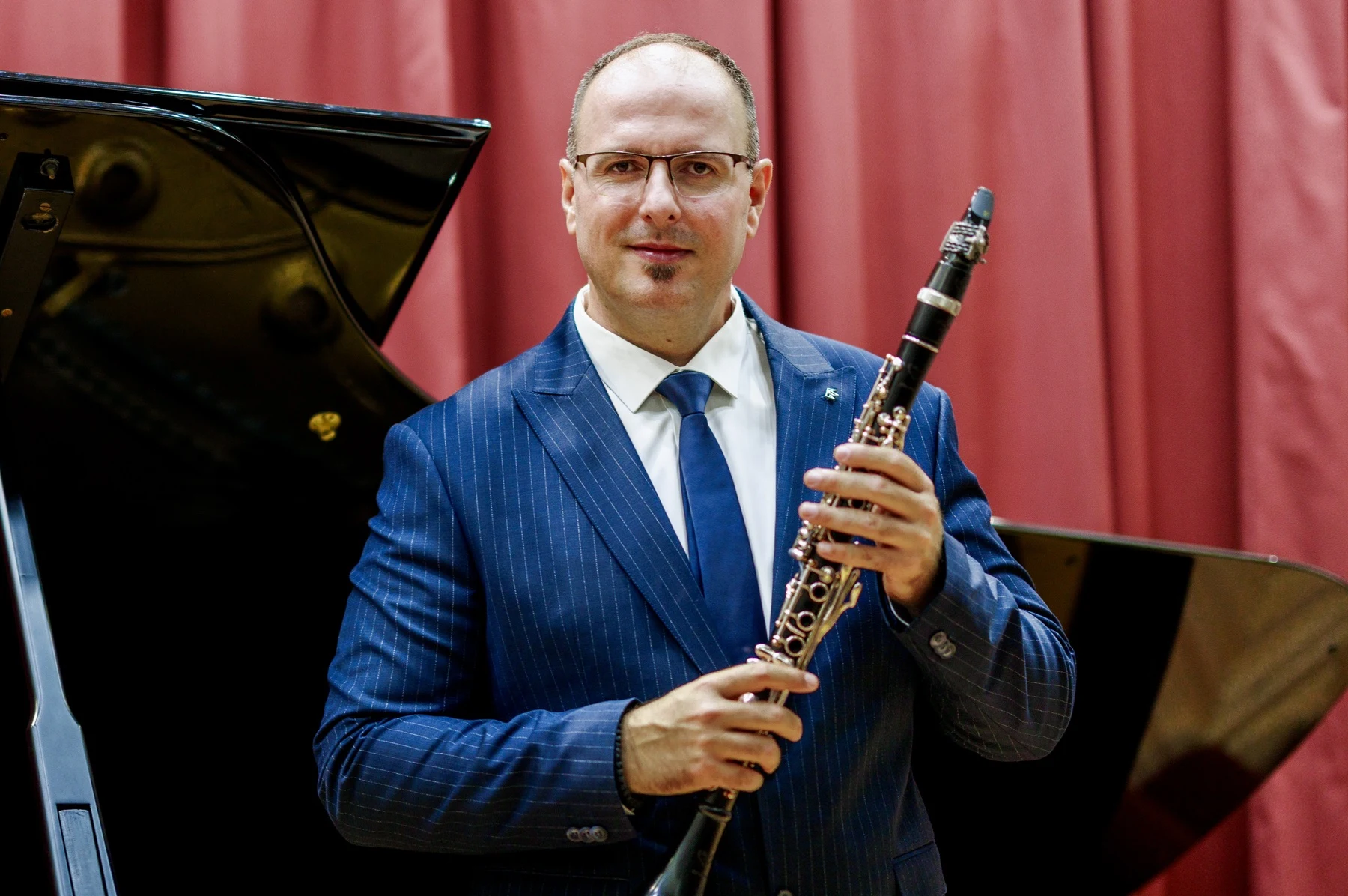 Portrait of Milos holding his clarinet